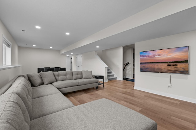 12946 Jewell Cir, Blaine, MN 55449 - living area with stairway, light wood-style flooring, recessed lighting, and baseboards