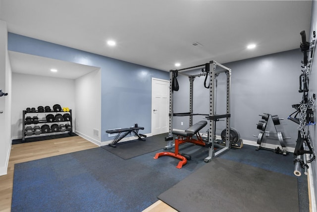 12946 Jewell Cir, Blaine, MN 55449 - exercise room with recessed lighting, baseboards, and wood finished floors