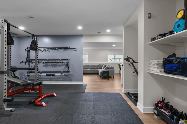 12946 Jewell Cir, Blaine, MN 55449 - workout area featuring recessed lighting, wood finished floors, and baseboards