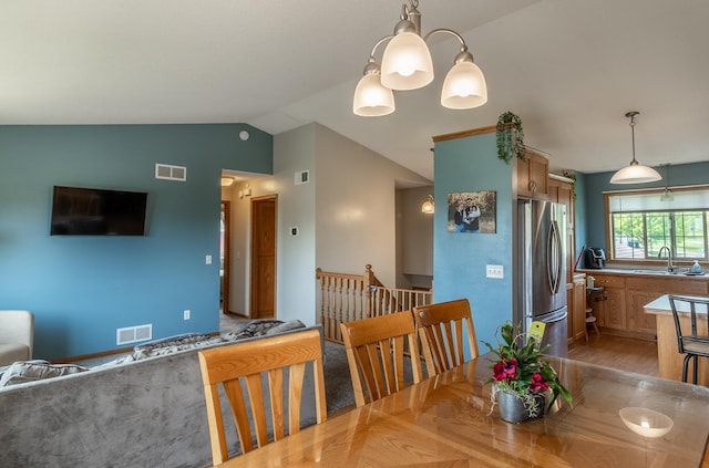 250 18th Ave SE, Saint Joseph, MN 56374 - dining space with vaulted ceiling and light wood-type flooring