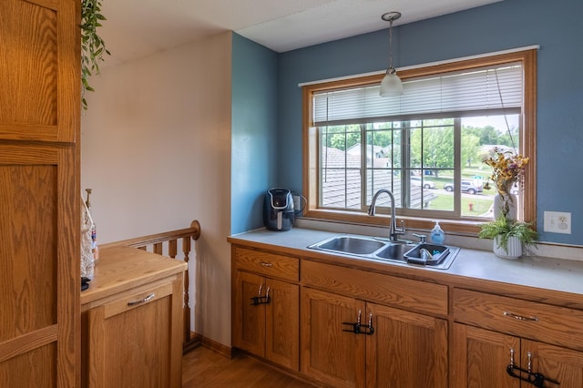 250 18th Ave SE, Saint Joseph, MN 56374 - kitchen with a sink, light countertops, and brown cabinets
