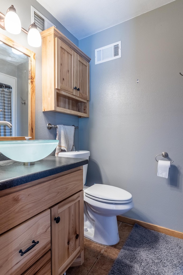 250 18th Ave SE, Saint Joseph, MN 56374 - bathroom featuring vanity, toilet, and baseboards