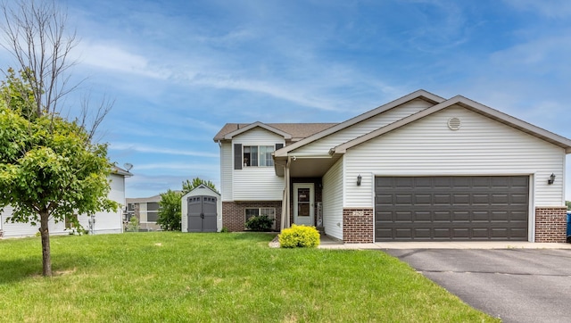 250 18th Ave SE, Saint Joseph, MN 56374 - split level home featuring brick siding, a garage, asphalt driveway, and a front lawn