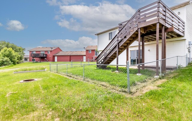 250 18th Ave SE, Saint Joseph, MN 56374 - back of house with stairway, a fire pit, and a deck