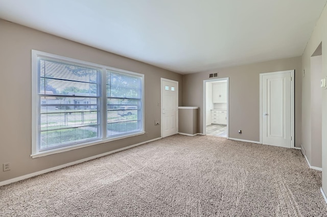 4921 Fremont Ave N, Minneapolis, MN 55430 - unfurnished bedroom with carpet floors, baseboards, and ensuite bath