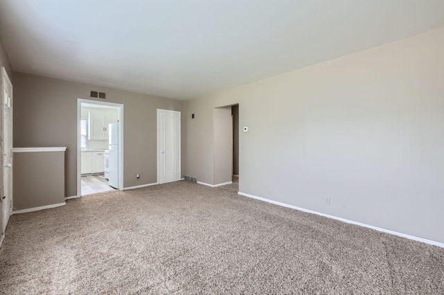 4921 Fremont Ave N, Minneapolis, MN 55430 - spare room featuring light carpet and baseboards