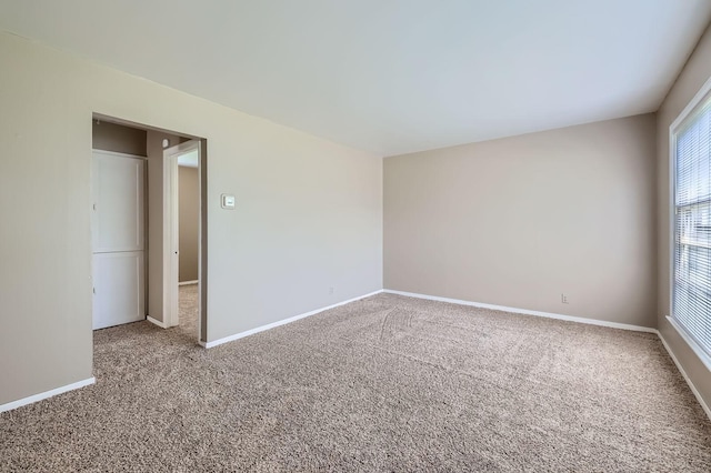 4921 Fremont Ave N, Minneapolis, MN 55430 - carpeted empty room featuring baseboards