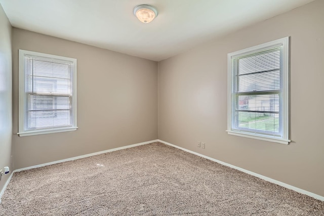 4921 Fremont Ave N, Minneapolis, MN 55430 - carpeted spare room with baseboards