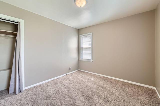 4921 Fremont Ave N, Minneapolis, MN 55430 - unfurnished bedroom featuring carpet floors, baseboards, and a closet