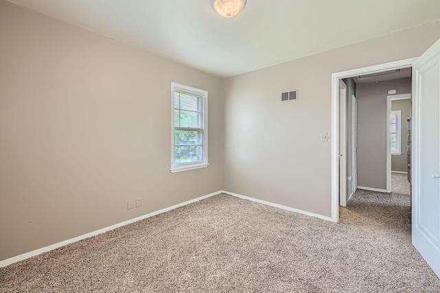 4921 Fremont Ave N, Minneapolis, MN 55430 - empty room with attic access, carpet, and baseboards
