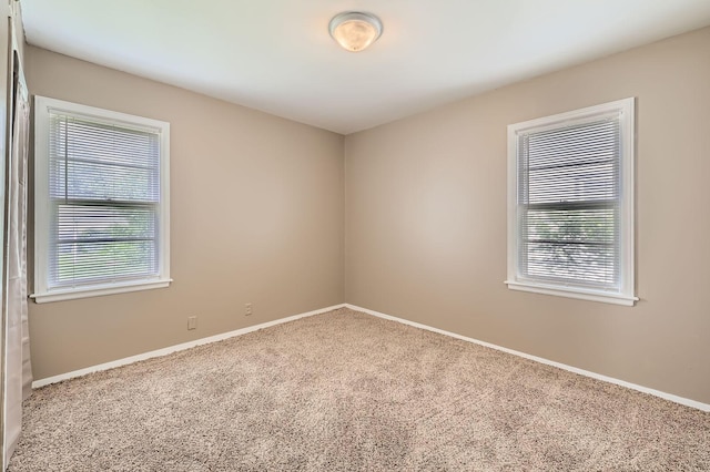 4921 Fremont Ave N, Minneapolis, MN 55430 - carpeted spare room with baseboards