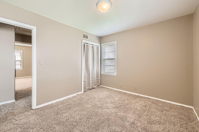 4921 Fremont Ave N, Minneapolis, MN 55430 - unfurnished bedroom featuring carpet, baseboards, and a closet