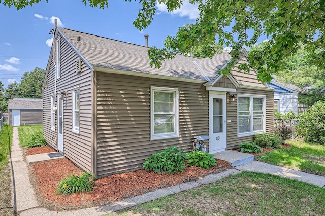 4921 Fremont Ave N, Minneapolis, MN 55430 - bungalow-style home featuring a shingled roof