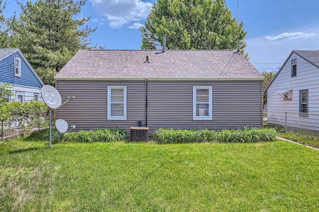 4921 Fremont Ave N, Minneapolis, MN 55430 - back of house with roof with shingles and central AC