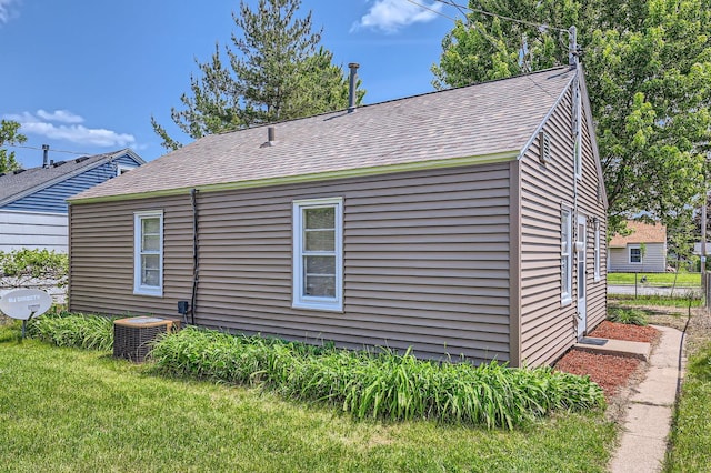 4921 Fremont Ave N, Minneapolis, MN 55430 - view of side of home with central air condition unit and roof with shingles
