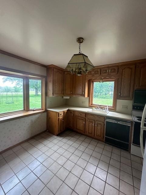 700 Oakland Pl NE, Austin, MN 55912 - kitchen featuring dishwasher, light countertops, a sink, a chandelier, and light tile patterned flooring