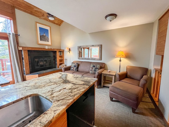 529 Moose Mountain Dr, Lutsen Twp, MN 55615 - carpeted living area with a glass covered fireplace