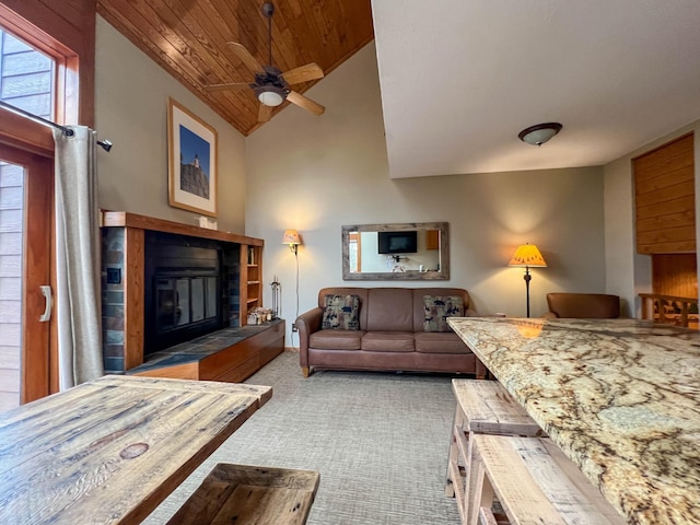 529 Moose Mountain Dr, Lutsen Twp, MN 55615 - carpeted living room featuring a tile fireplace, wooden ceiling, a ceiling fan, and lofted ceiling