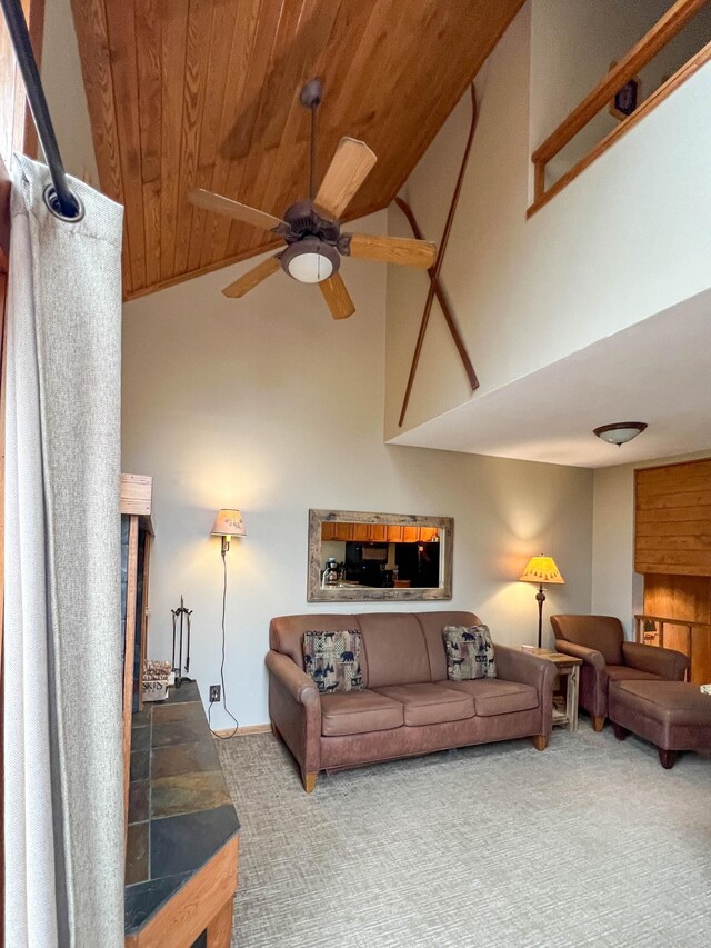 529 Moose Mountain Dr, Lutsen Twp, MN 55615 - living room featuring wood ceiling, carpet floors, high vaulted ceiling, and ceiling fan