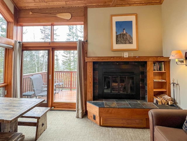529 Moose Mountain Dr, Lutsen Twp, MN 55615 - carpeted living area featuring a fireplace and wooden ceiling