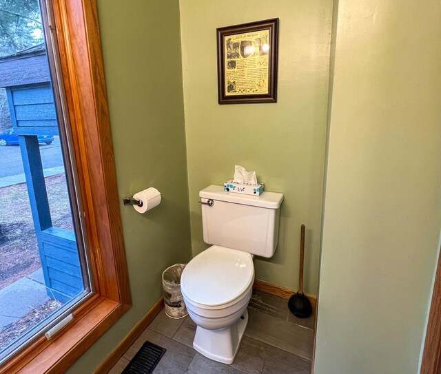 529 Moose Mountain Dr, Lutsen Twp, MN 55615 - bathroom with toilet, baseboards, and tile patterned flooring