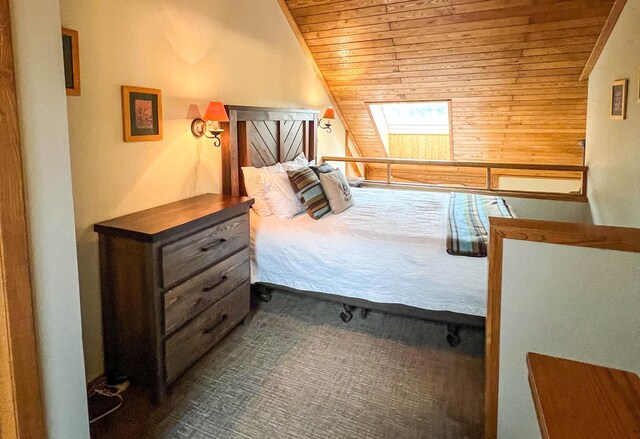 529 Moose Mountain Dr, Lutsen Twp, MN 55615 - carpeted bedroom with wooden ceiling, vaulted ceiling, and wooden walls