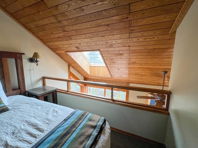 529 Moose Mountain Dr, Lutsen Twp, MN 55615 - bedroom with a skylight, wood ceiling, lofted ceiling, carpet floors, and multiple windows