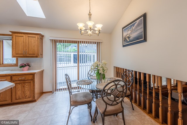 2226 Whispering Trl, Eagan, MN 55122 - dining area featuring vaulted ceiling, a chandelier, and a skylight