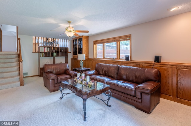 2226 Whispering Trl, Eagan, MN 55122 - living area featuring stairway, a ceiling fan, light carpet, and wainscoting