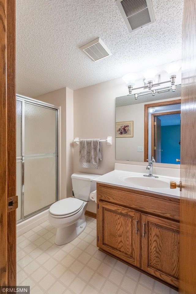 2226 Whispering Trl, Eagan, MN 55122 - bathroom featuring toilet, vanity, a stall shower, and tile patterned floors