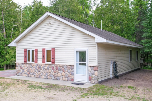 10547 Vermeil Dr NE, Deer River, MN 56636 - view of front of property featuring roof with shingles and stone siding