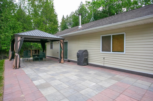 10547 Vermeil Dr NE, Deer River, MN 56636 - view of patio with a gazebo and area for grilling