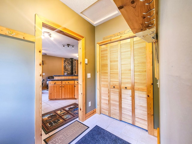 10547 Vermeil Dr NE, Deer River, MN 56636 - bathroom with tile patterned floors, vanity, and a textured ceiling