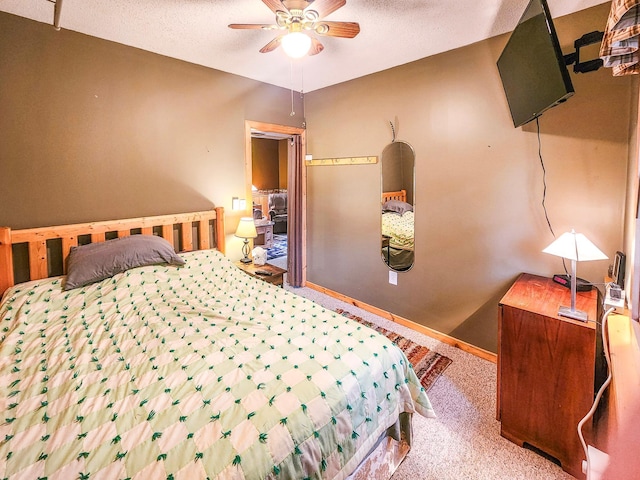 10547 Vermeil Dr NE, Deer River, MN 56636 - carpeted bedroom featuring baseboards, a textured ceiling, and a ceiling fan