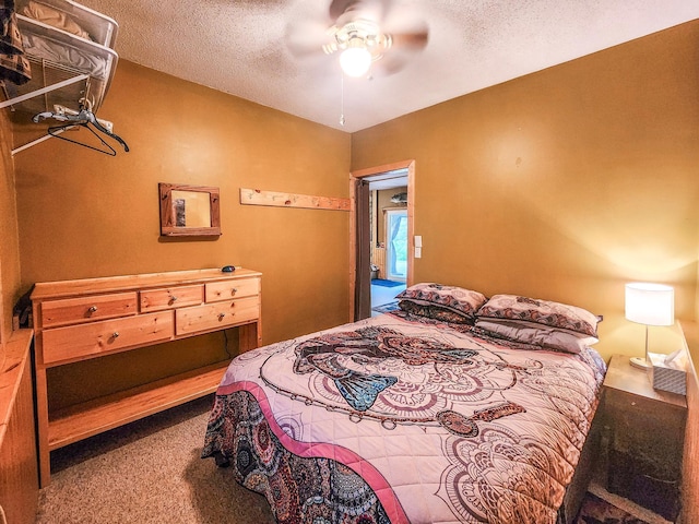 10547 Vermeil Dr NE, Deer River, MN 56636 - bedroom featuring carpet floors, a textured ceiling, and ceiling fan