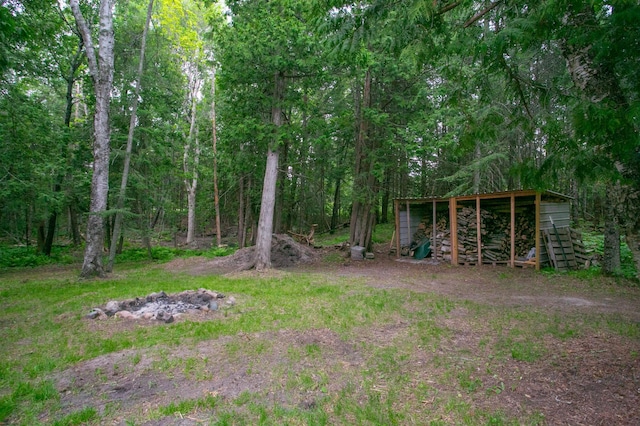10547 Vermeil Dr NE, Deer River, MN 56636 - view of yard featuring an outdoor structure, an outbuilding, and a view of trees