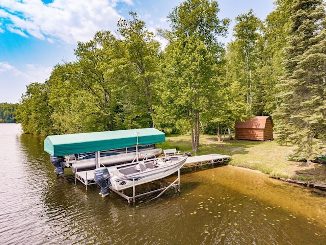 45517 County Road 346, Balsam Twp, MN 55709 - dock featuring boat lift, a water view, and a forest view