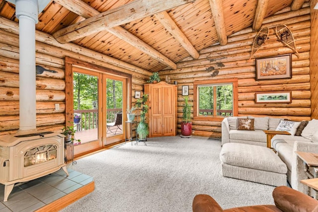 45517 County Road 346, Balsam Twp, MN 55709 - carpeted living area with a wood stove, wood ceiling, healthy amount of natural light, and rustic walls