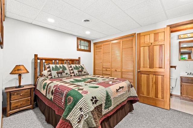 45517 County Road 346, Balsam Twp, MN 55709 - carpeted bedroom with a closet, a drop ceiling, recessed lighting, and ensuite bath