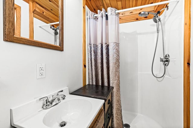 45517 County Road 346, Balsam Twp, MN 55709 - bathroom featuring a shower with curtain, vanity, and wood ceiling
