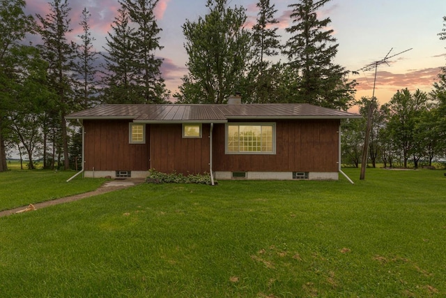 51343 20th Ave, Kenyon Twp, MN 55946 - view of side of property featuring a metal roof, a chimney, and a lawn