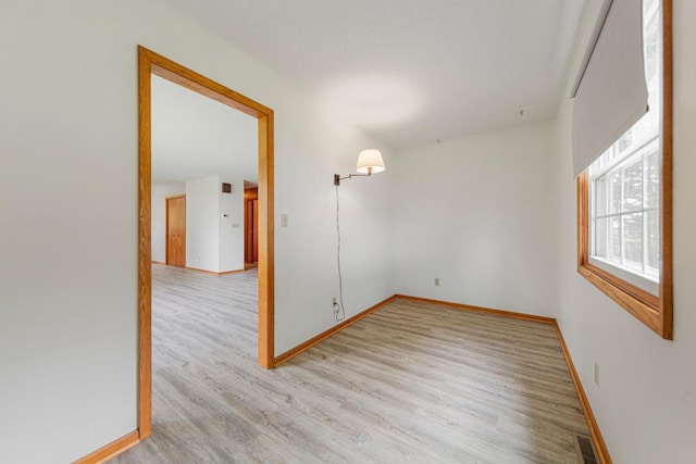 51343 20th Ave, Kenyon Twp, MN 55946 - empty room with light wood-style floors and baseboards