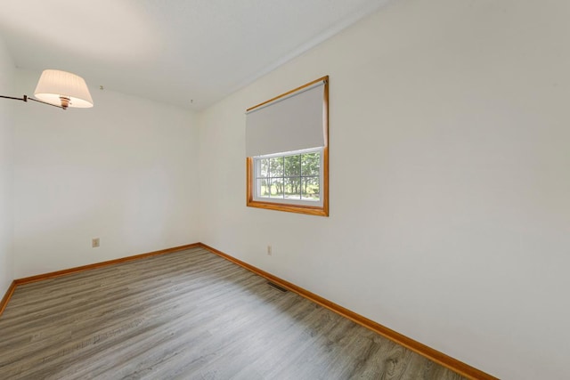 51343 20th Ave, Kenyon Twp, MN 55946 - unfurnished room featuring baseboards and wood finished floors