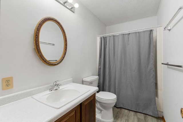 51343 20th Ave, Kenyon Twp, MN 55946 - full bathroom with vanity, wood finished floors, a textured ceiling, and shower / bath combination with curtain
