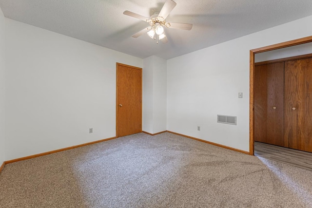 51343 20th Ave, Kenyon Twp, MN 55946 - unfurnished room with carpet floors, a ceiling fan, and a textured ceiling