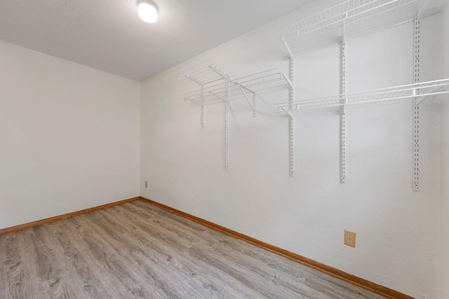 51343 20th Ave, Kenyon Twp, MN 55946 - spacious closet featuring wood finished floors