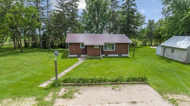 51343 20th Ave, Kenyon Twp, MN 55946 - view of front of home featuring a metal roof, a front lawn, and view of scattered trees
