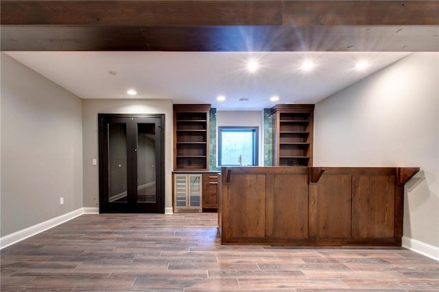 TBB403 College St, Northfield, MN 55057 - bar area featuring beverage cooler, baseboards, recessed lighting, and wood finished floors