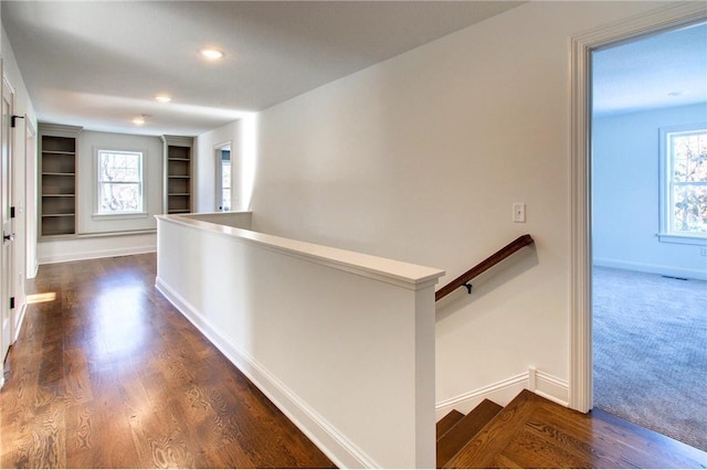 TBB403 College St, Northfield, MN 55057 - hall featuring an upstairs landing, baseboards, built in features, and recessed lighting