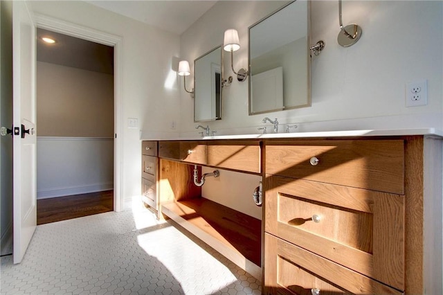 TBB403 College St, Northfield, MN 55057 - bathroom with vanity and baseboards